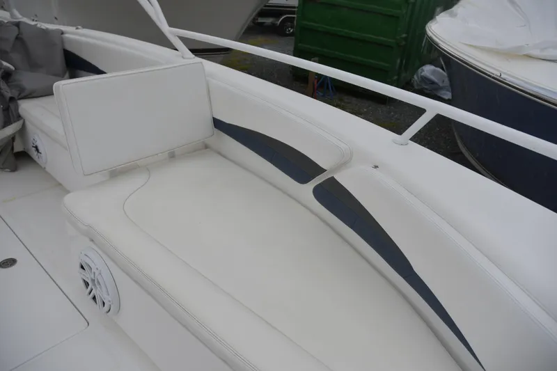 Slide: The Image of 2010 Deep Impact 36 TE boat with white cushioned seating and speaker. - 17