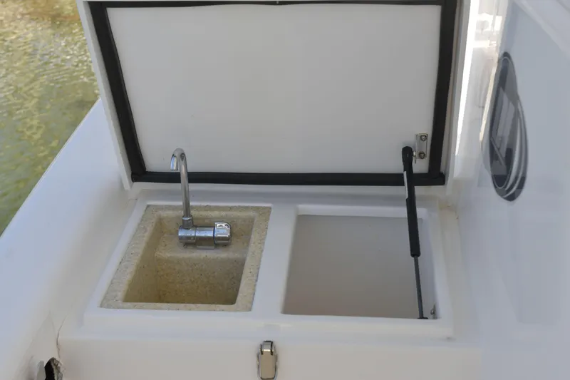 Slide: The Image of Boat sink and storage compartment on a 2010 Deep Impact 36 TE. - 4