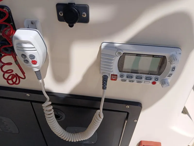 Slide: The Image of Boat communication system on a 2013 BlackJack 224, featuring a mounted radio and microphone. - 4