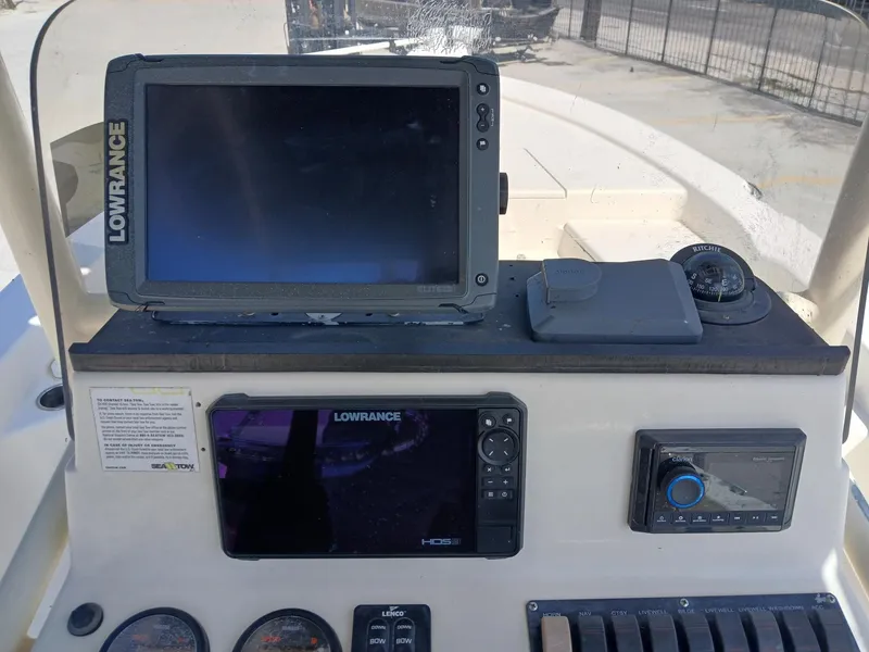 Slide: The Image of Control panel of a 2013 BlackJack 224 boat with Lowrance navigation systems. - 5