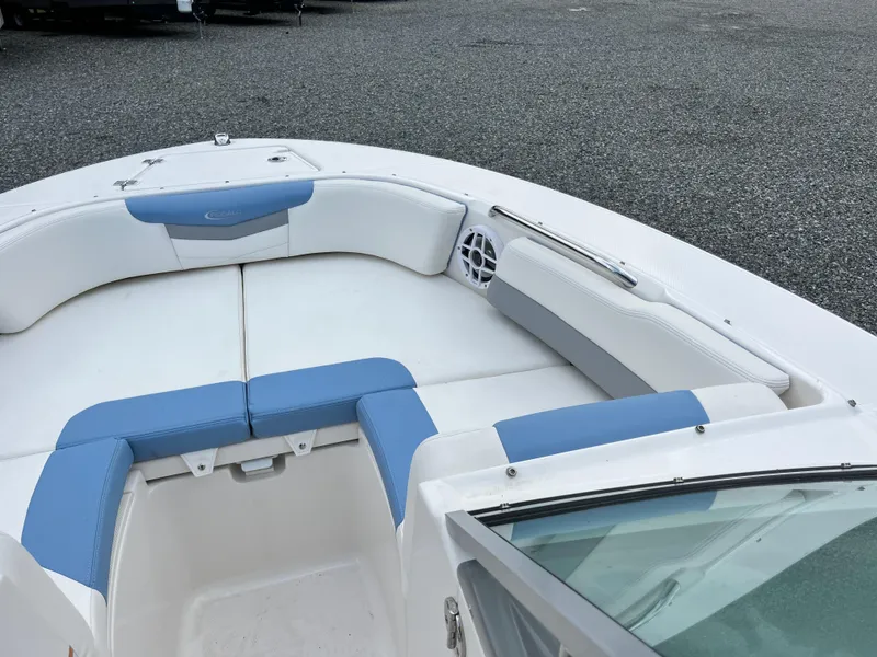Slide: The Image of 2024 Robalo R207 Dual Console boat interior with blue and white seating. - 10