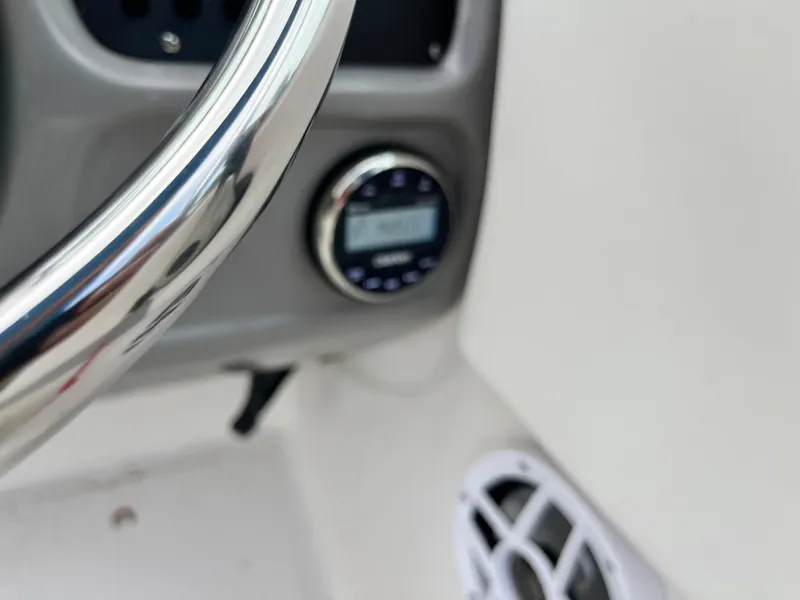 Slide: The Image of 2024 Robalo R207 Dual Console dashboard with steering wheel and control panel. - 14