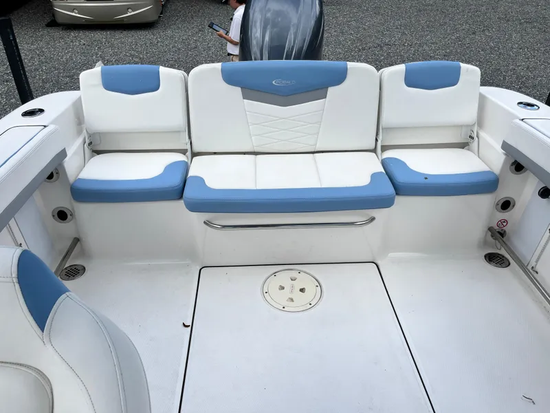 Slide: The Image of 2024 Robalo R207 Dual Console boat interior with blue and white seating. - 18