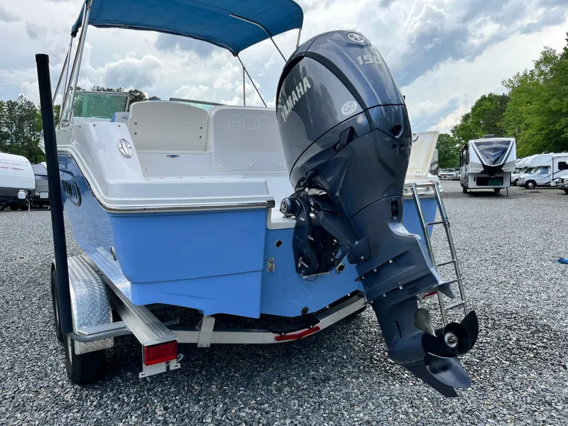 Slide: The Image of 2024 Robalo R207 Dual Console boat with Yamaha outboard motor on a trailer. - 3