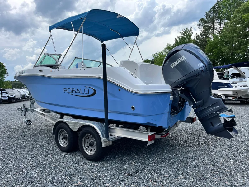 Slide: The Image of 2024 Robalo R207 Dual Console boat with Yamaha engine on a trailer. - 4