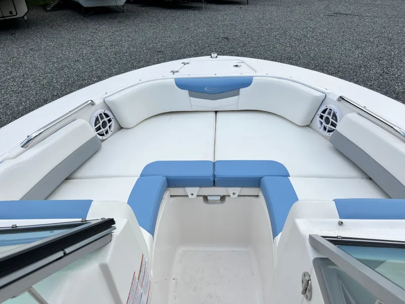 Slide: The Image of 2024 Robalo R207 Dual Console boat interior with blue and white seating. - 8