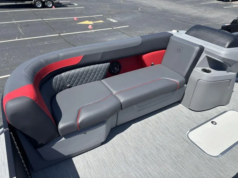 Slide: The Image of 2025 Godfrey SWEETWATER 2286 SFL boat interior with gray and red seating. - 10