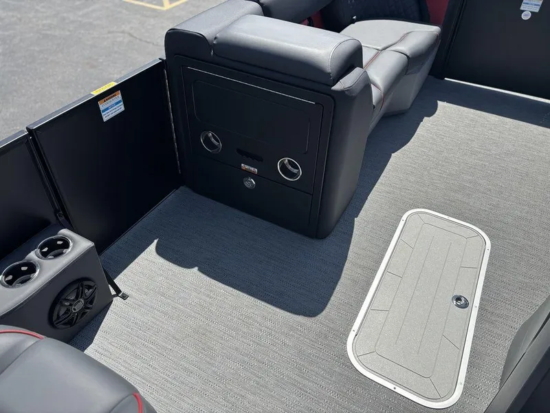 Slide: The Image of 2025 Godfrey SWEETWATER 2286 SFL interior with seating, storage, and cup holders. - 13