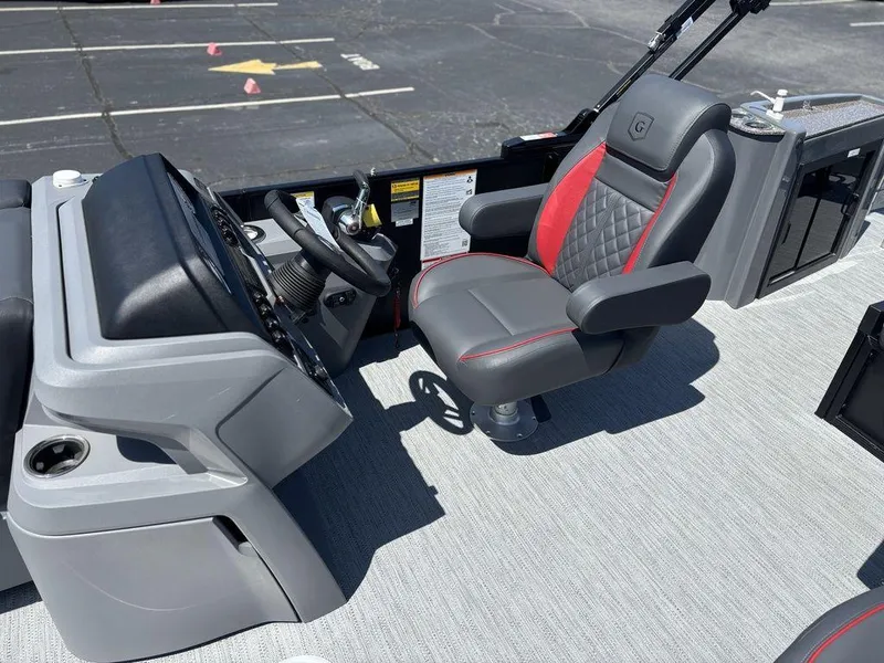 Slide: The Image of Captain's seat of 2025 Godfrey SWEETWATER 2286 SFL boat, featuring modern design and controls. - 14