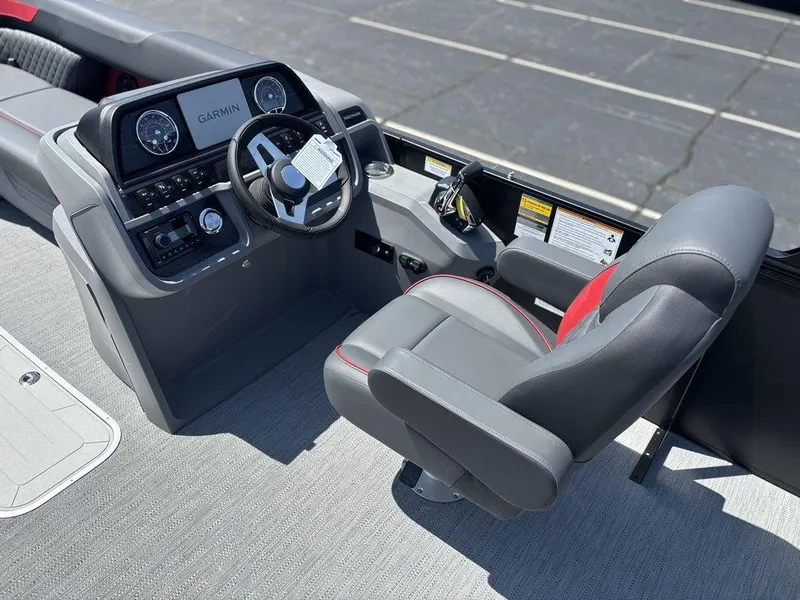 Slide: The Image of 2025 Godfrey SWEETWATER 2286 SFL boat cockpit with steering wheel and control panel. - 15