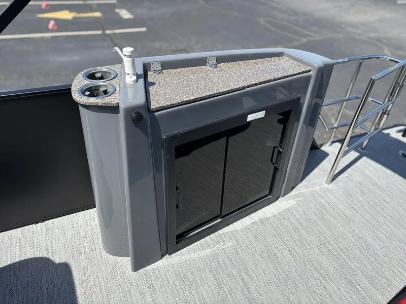 Slide: The Image of 2025 Godfrey SWEETWATER 2286 SFL boat deck with storage cabinet and cup holders. - 19