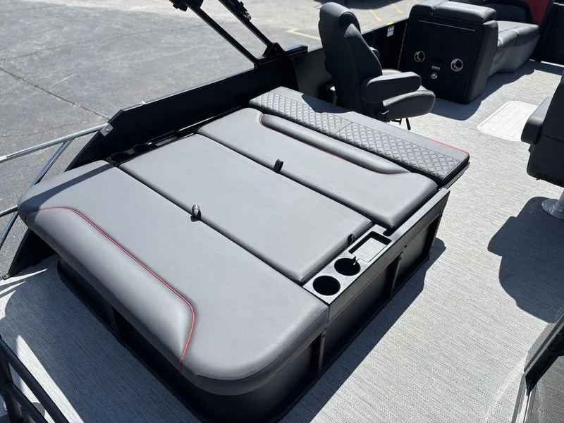 Slide: The Image of 2025 Godfrey SWEETWATER 2286 SFL boat interior with cushioned seating and cup holders. - 21