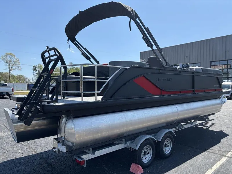 Slide: The Image of 2025 Godfrey SWEETWATER 2286 SFL pontoon boat on trailer, black and red design. - 5