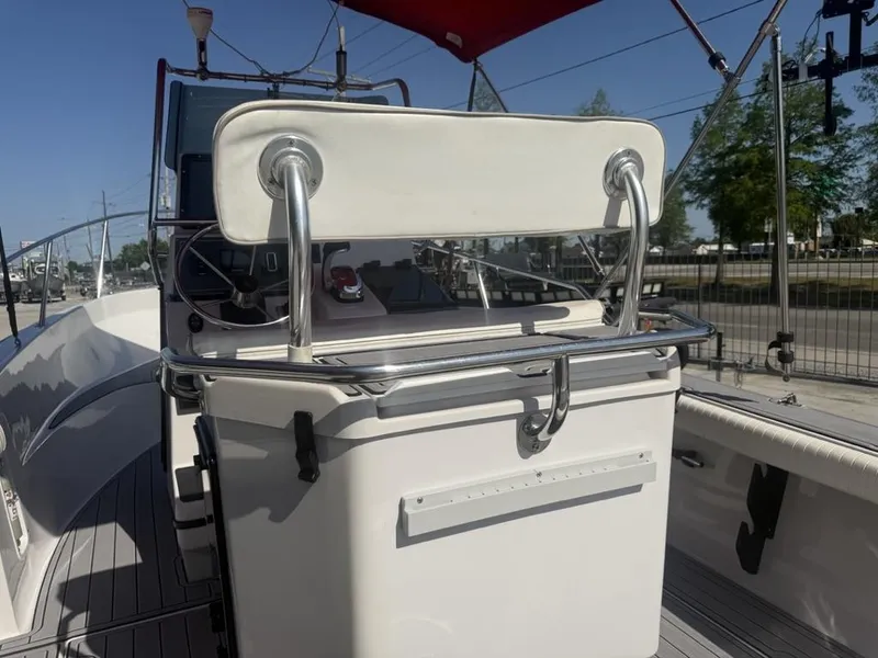 Slide: The Image of 1996 Boston Whaler 21 Outrage boat interior with steering wheel and seating. - 15
