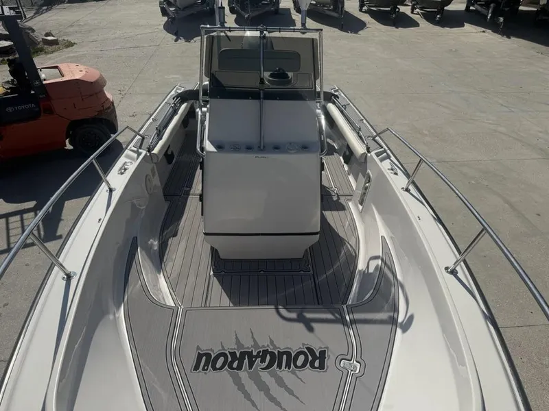 Slide: The Image of 1996 Boston Whaler 21 Outrage boat with center console and custom flooring design. - 21