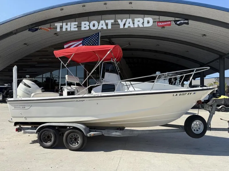 Slide: The Image of 1996 Boston Whaler 21 Outrage boat with red canopy on trailer at The Boat Yard. - 4