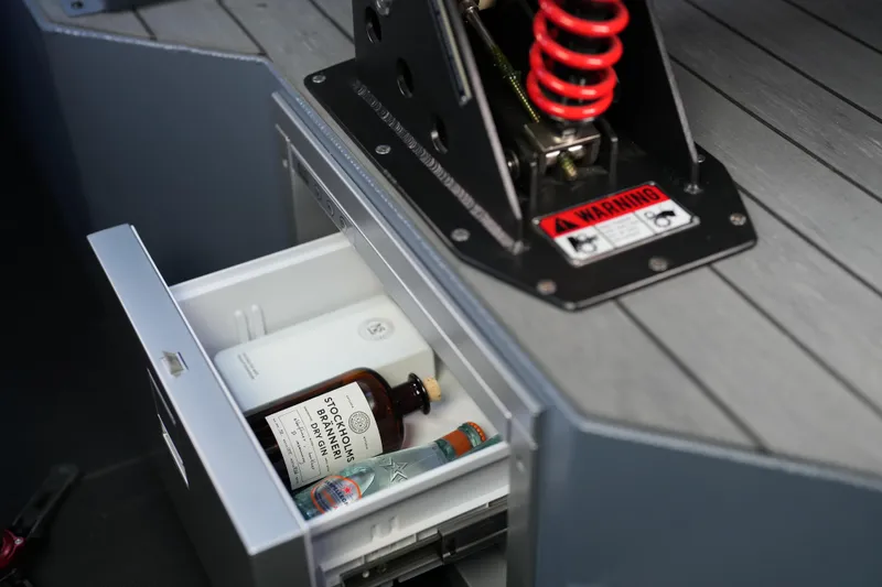 Slide: The Image of Drawer with beverages inside Jaktar J30 Black Vision 2026 vehicle interior. - 18
