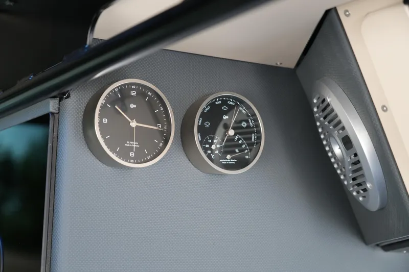 Slide: The Image of Interior dashboard of 2026 Jaktar J30 Black Vision with analog clock and gauge. - 21