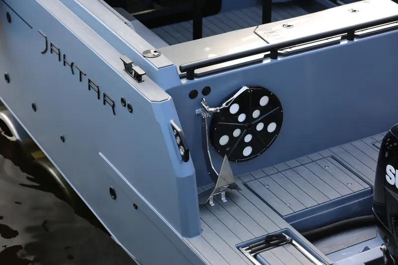 Slide: The Image of 2026 Jaktar J30 Black Vision boat deck with anchor and motor detail. - 29