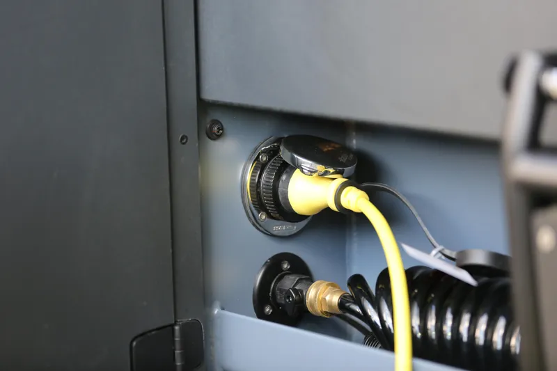 Slide: The Image of Charging port of Jaktar J30 Black Vision 2026 with yellow cable connected. - 37