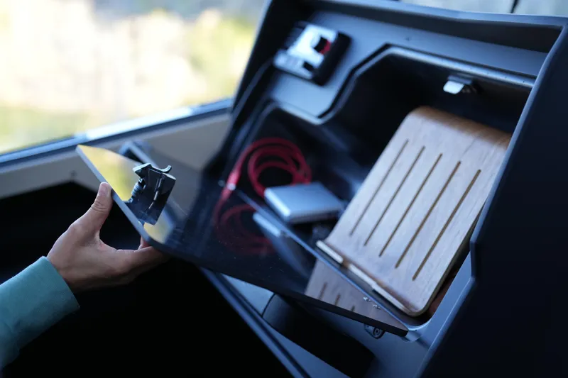 Slide: The Image of Interior of 2026 Jaktar J30 Black Vision with storage compartment and accessories. - 43