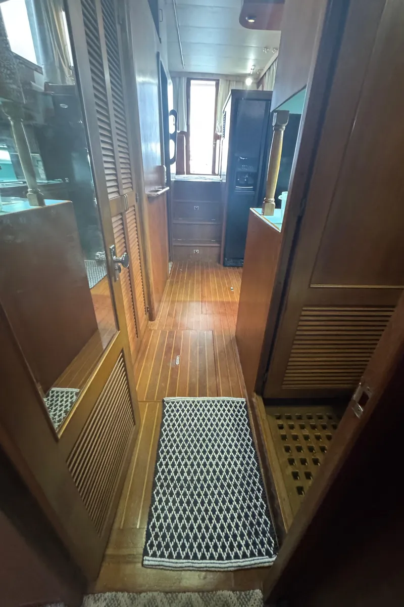 Slide: The Image of 1989 Ricker 48 Convertible yacht interior with wooden flooring and cabinetry. - 36