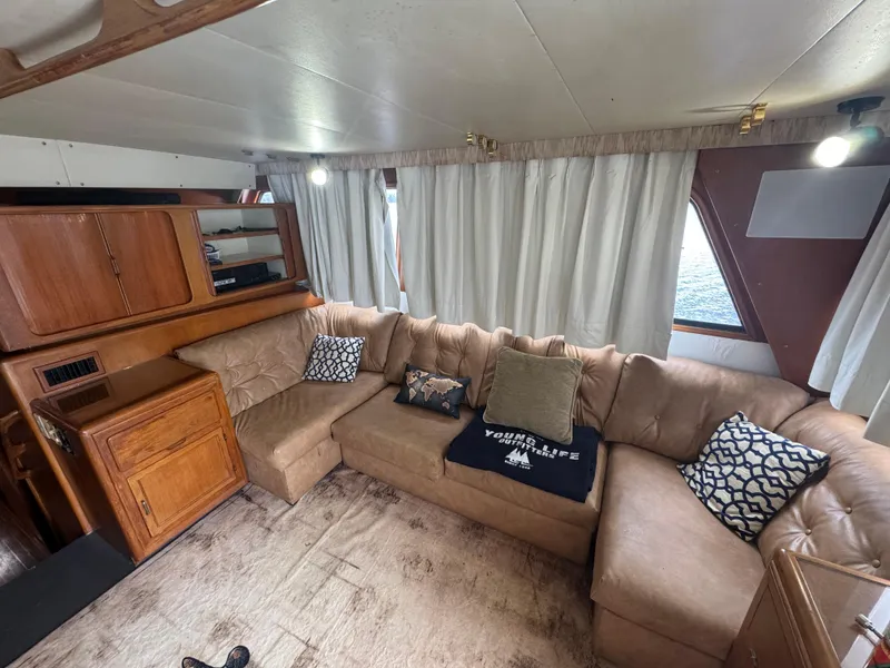 Slide: The Image of Luxurious interior of 1989 Ricker 48 Convertible yacht with plush seating and elegant decor. - 4