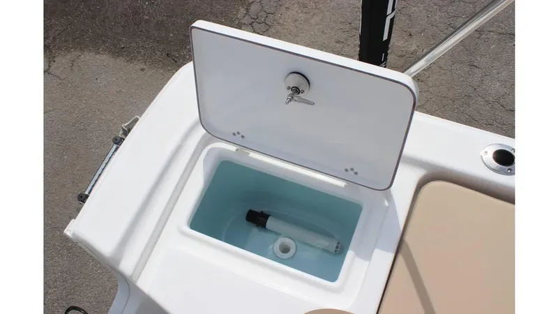 Slide: The Image of Livewell compartment on 2025 Sea Pro 172 boat, featuring a white lid and interior. - 10