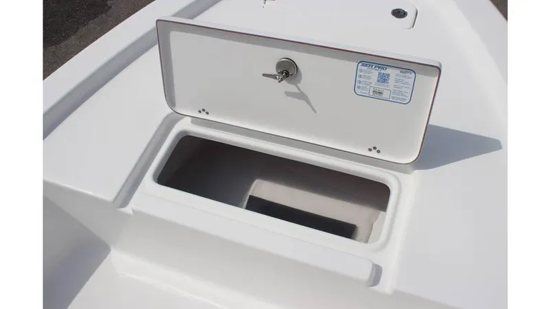 Slide: The Image of 2025 Sea Pro 172 boat storage compartment with open hatch and key lock. - 15