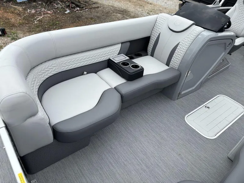 Slide: The Image of Luxurious seating on 2025 Godfrey Monaco 235 DFL pontoon boat with cup holders and stylish design. - 10