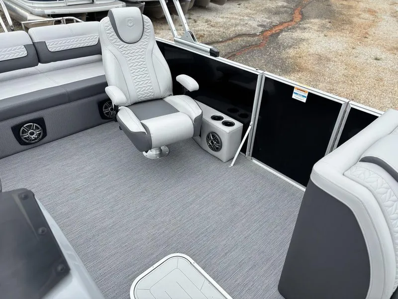 Slide: The Image of Luxurious seating on 2025 Godfrey Monaco 235 DFL pontoon boat with cup holders and speakers. - 11
