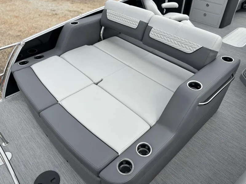 Slide: The Image of Luxurious seating on 2025 Godfrey Monaco 235 DFL boat with cup holders and modern design. - 18