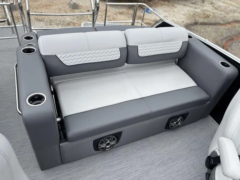 Slide: The Image of Luxury seating on 2025 Godfrey Monaco 235 DFL boat with cup holders and speakers. - 19