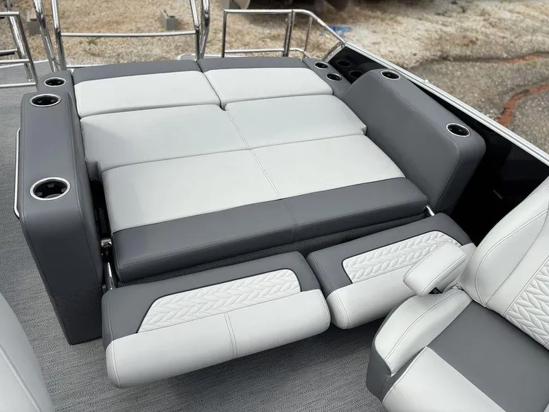 Slide: The Image of 2025 Godfrey Monaco 235 DFL boat interior with luxurious gray seating and cup holders. - 20