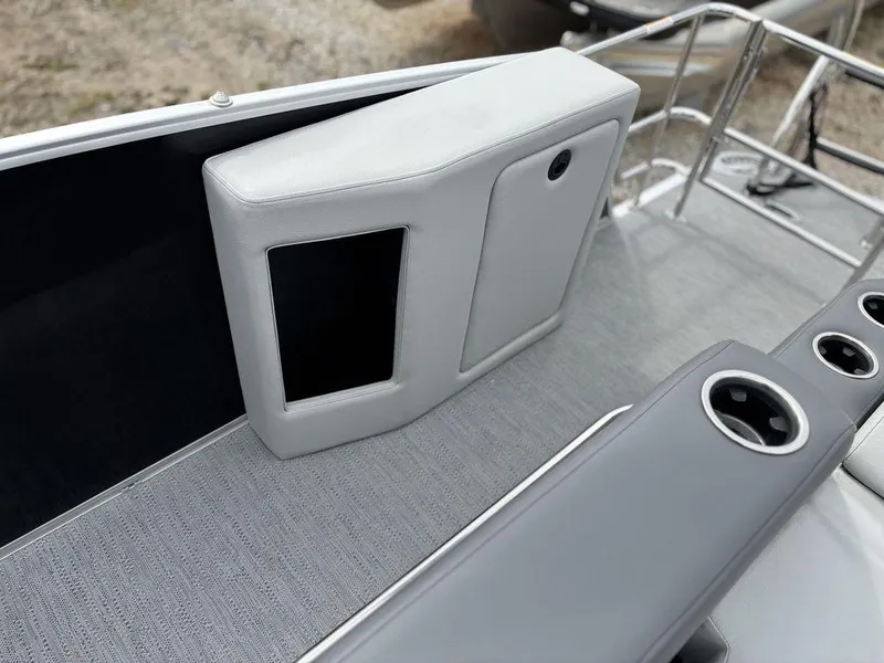 Slide: The Image of 2025 Godfrey Monaco 235 DFL boat interior with sleek seating and cup holders. - 22