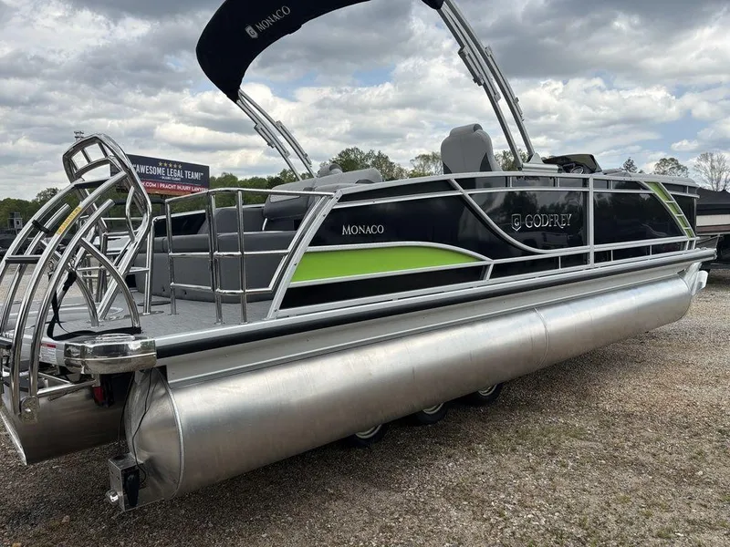 Slide: The Image of 2025 Godfrey Monaco 235 DFL pontoon boat with sleek design and modern features. - 4