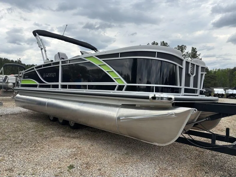 Slide: The Image of 2025 Godfrey Monaco 235 DFL pontoon boat with sleek design and green accents. - 8