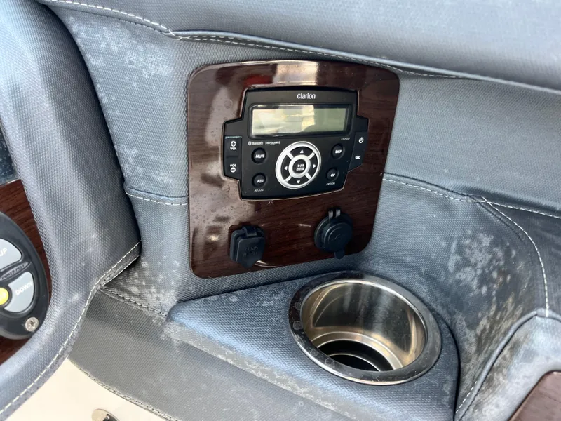 Slide: The Image of Control panel and cup holder on 2020 Chaparral 257 SSX boat interior. - 10