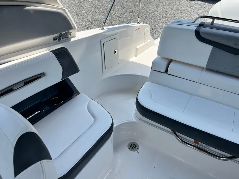 Slide: The Image of 2020 Chaparral 257 SSX boat interior with white and black seating. - 12