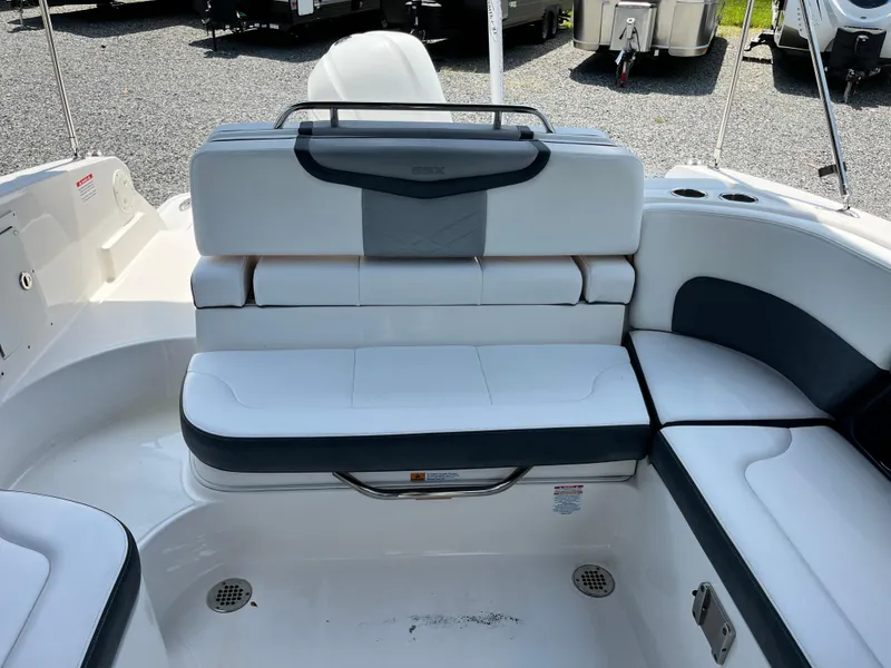 Slide: The Image of 2020 Chaparral 257 SSX boat interior with white and gray seating. - 13