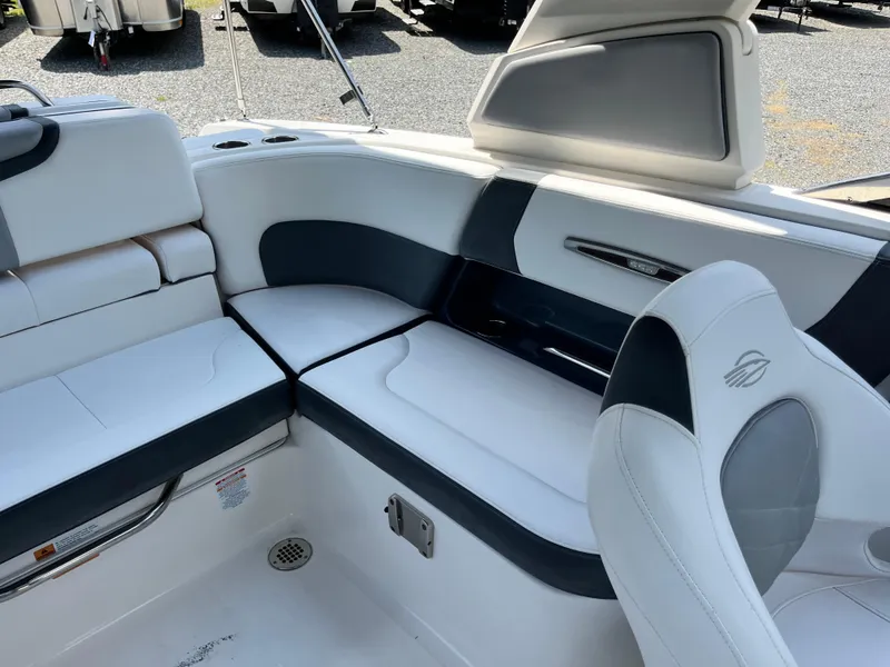 Slide: The Image of 2020 Chaparral 257 SSX boat interior with white and black seating. - 14