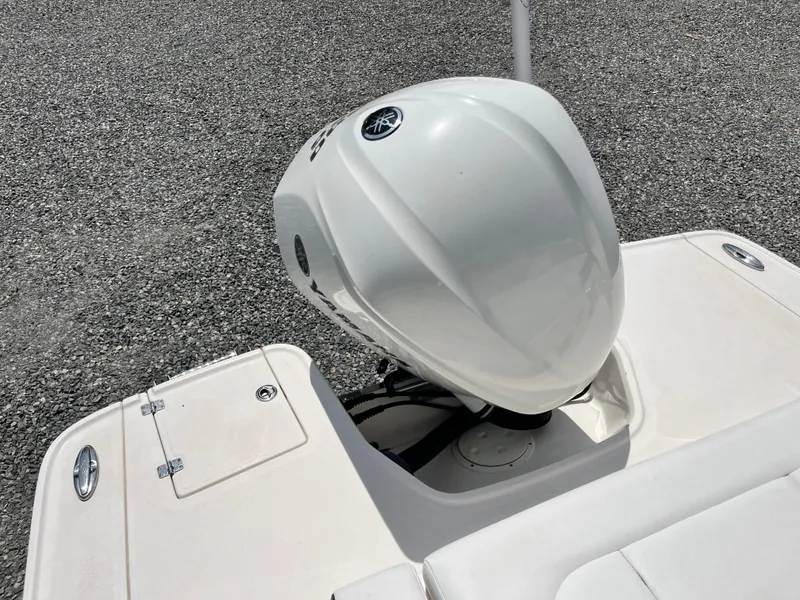 Slide: The Image of 2020 Chaparral 257 SSX boat engine on a gravel surface. - 18