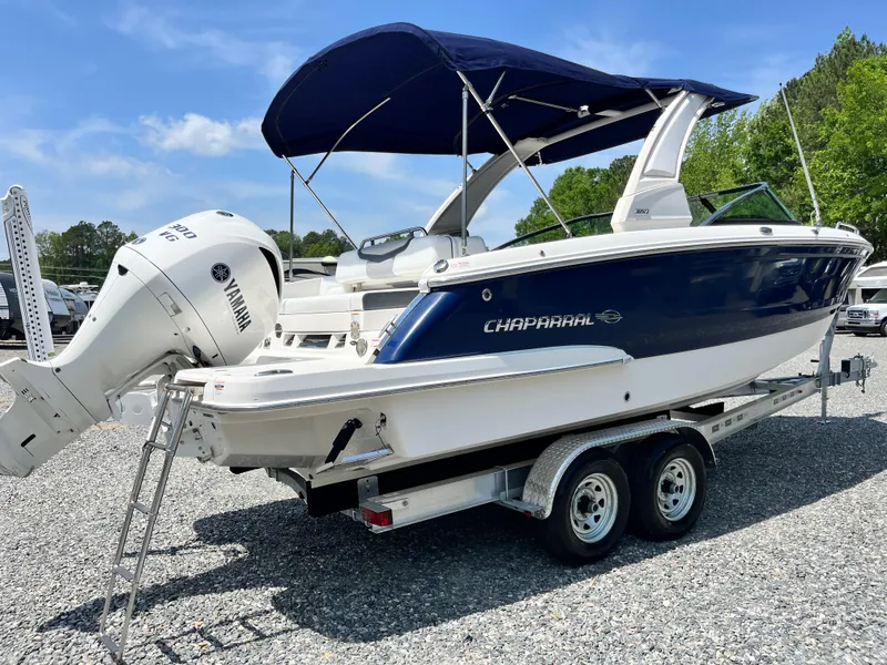 Slide: The Image of 2020 Chaparral 257 SSX boat on trailer with Yamaha outboard, blue and white design. - 3