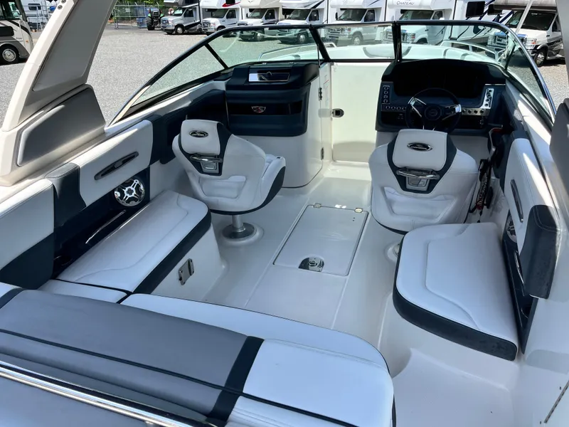 Slide: The Image of 2020 Chaparral 257 SSX boat interior with modern seating and dashboard. - 5