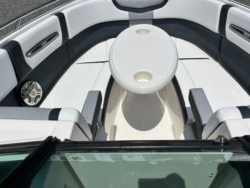 Slide: The Image of 2020 Chaparral 257 SSX boat interior with seating and table. - 6