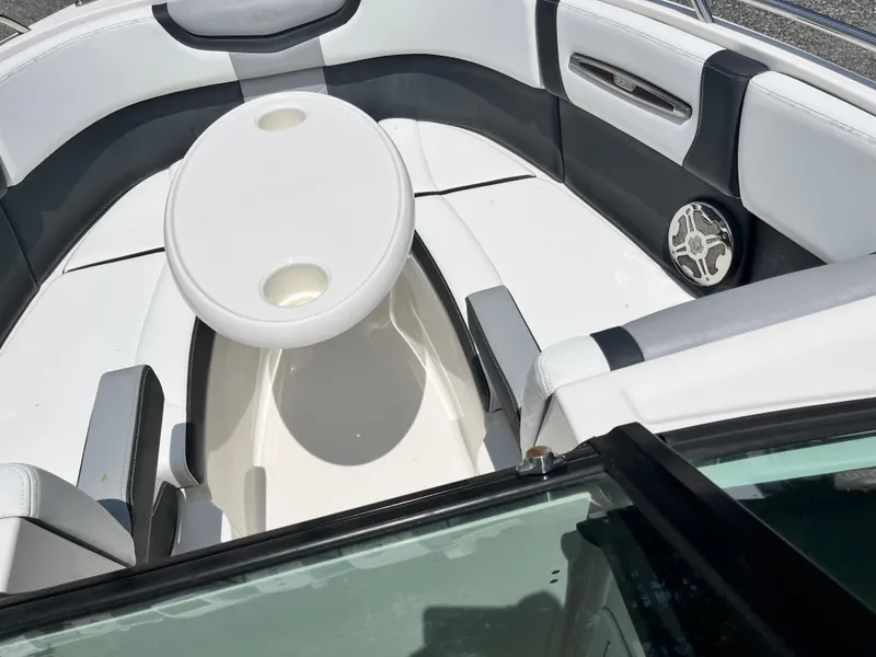 Slide: The Image of 2020 Chaparral 257 SSX boat interior with seating and table. - 8