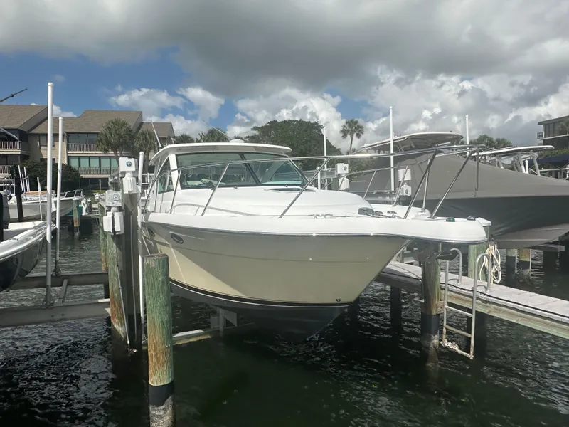 Slide: The Image of 2007 Tiara Yachts 3000 Open deck with seating, rope, and water view. - 10