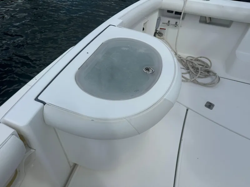 Slide: The Image of 2007 Tiara Yachts 3000 Open helm with steering wheel and navigation controls. - 18