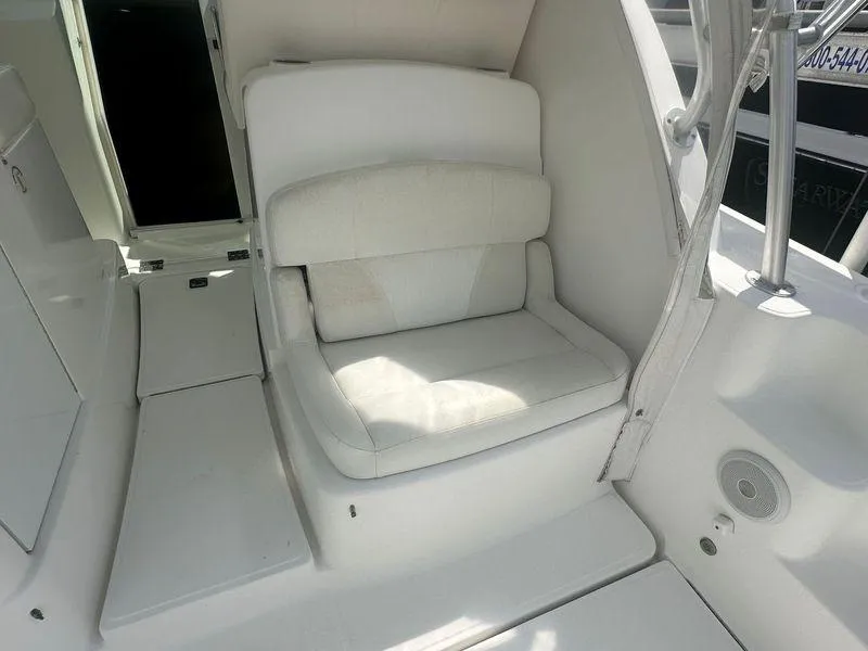 Slide: The Image of 2007 Tiara Yachts 3000 Open docked, showcasing sleek deck design and marina setting. - 19