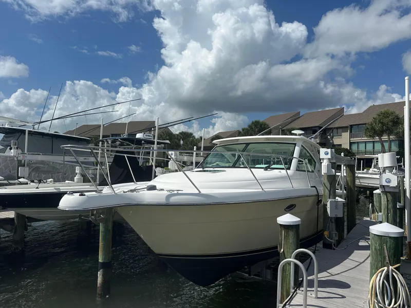 Slide: The Image of 2007 Tiara Yachts 3000 Open docked in marina, side view. - 2